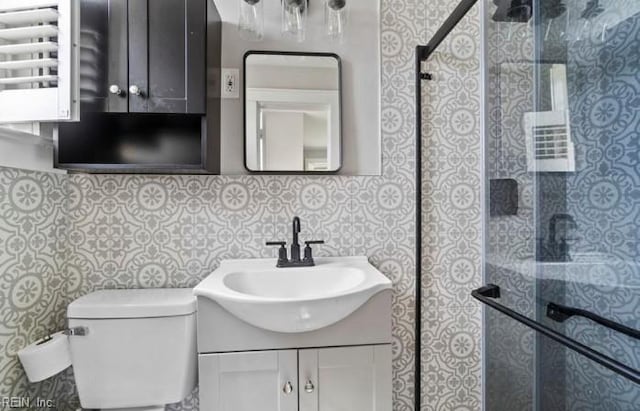 bathroom with decorative backsplash, toilet, walk in shower, and vanity