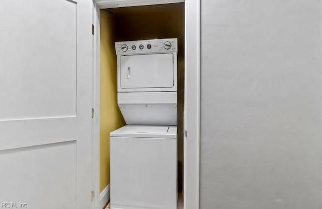 laundry area with stacked washer / drying machine