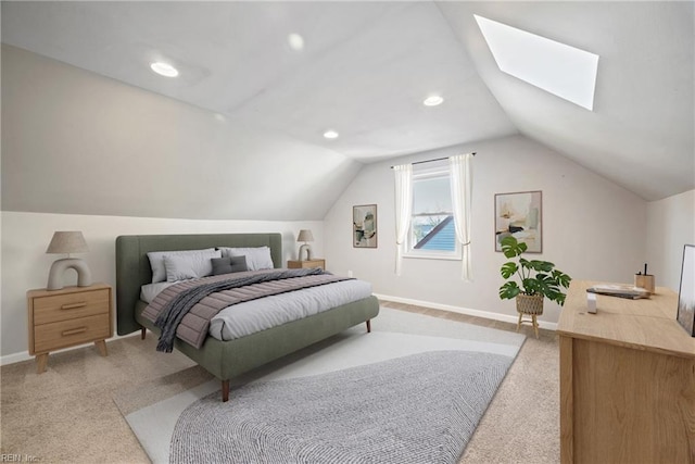 bedroom featuring light colored carpet and lofted ceiling with skylight