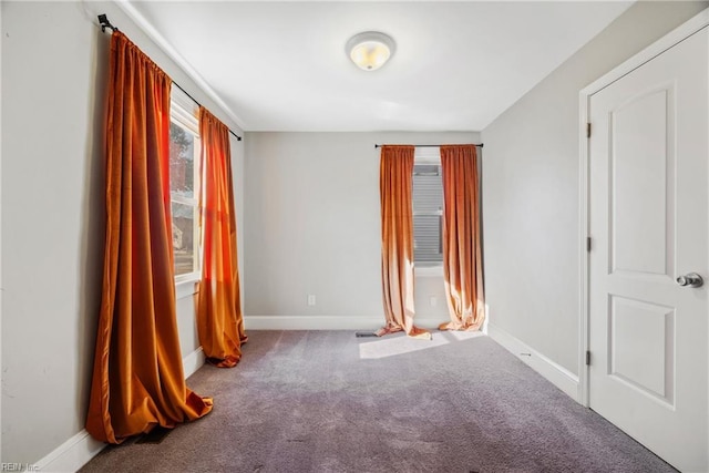 unfurnished room featuring carpet flooring