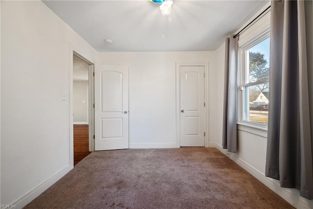 unfurnished bedroom featuring carpet