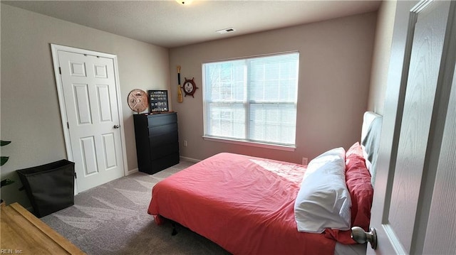 bedroom featuring light colored carpet