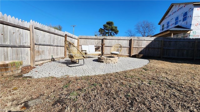 view of yard featuring a fire pit and a patio area