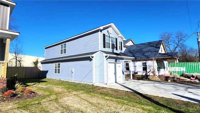 rear view of property with a lawn