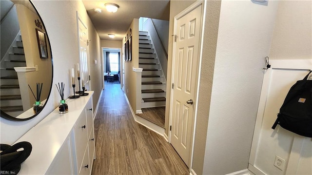 corridor with wood-type flooring