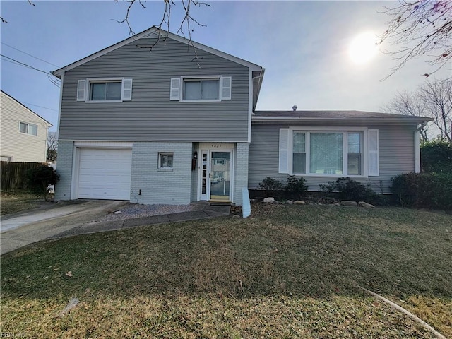 tri-level home featuring a front lawn and a garage