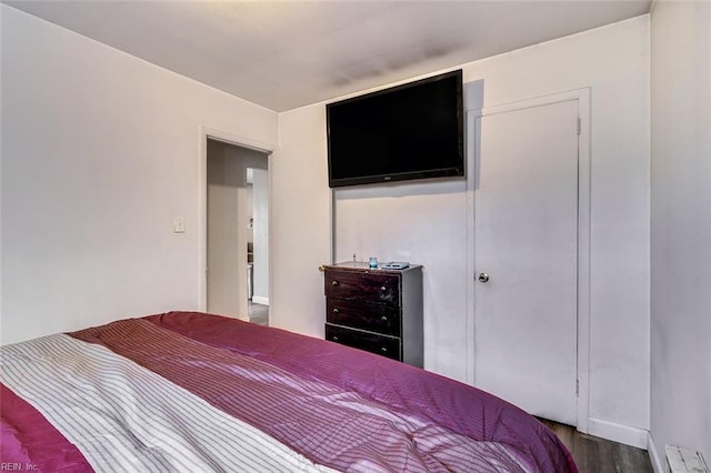 bedroom with hardwood / wood-style floors