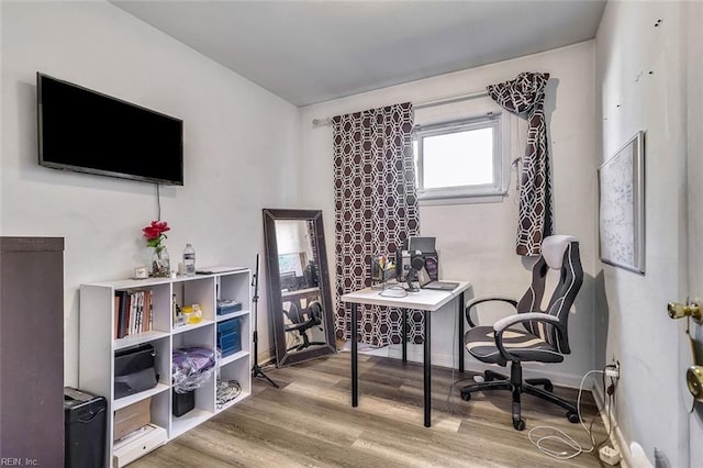 office space with hardwood / wood-style flooring