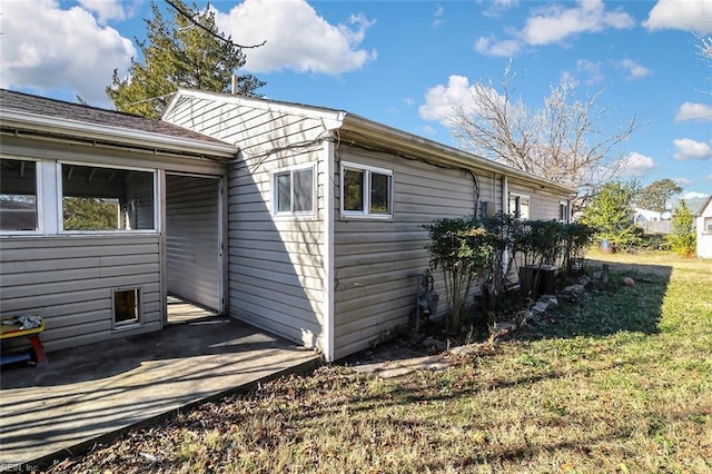 view of home's exterior featuring a yard and a patio