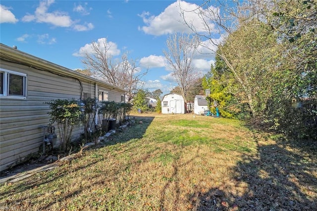 view of yard with a storage unit