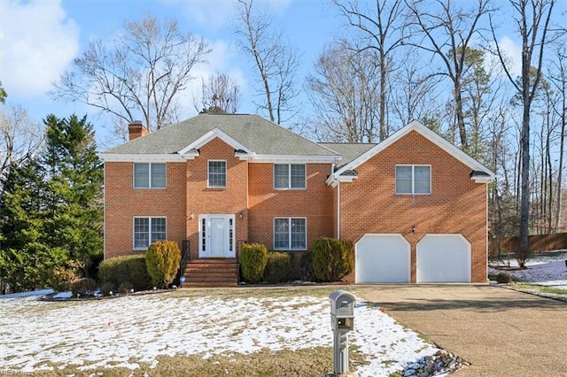 colonial home with a garage