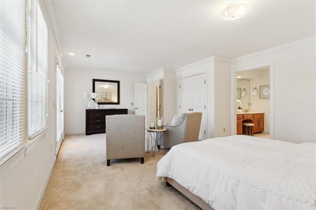 carpeted bedroom with ensuite bathroom, ornamental molding, and multiple windows