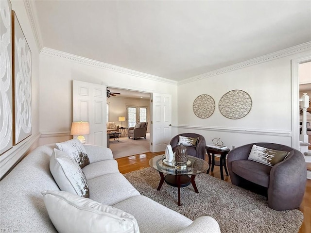 living room with hardwood / wood-style flooring and ceiling fan