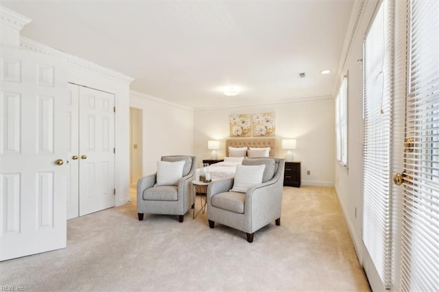 carpeted bedroom with a closet and ornamental molding