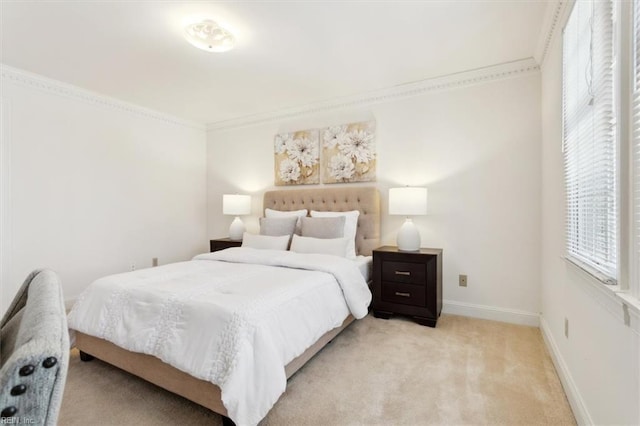 carpeted bedroom featuring crown molding