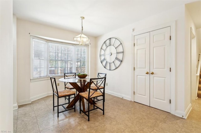 dining space with a notable chandelier