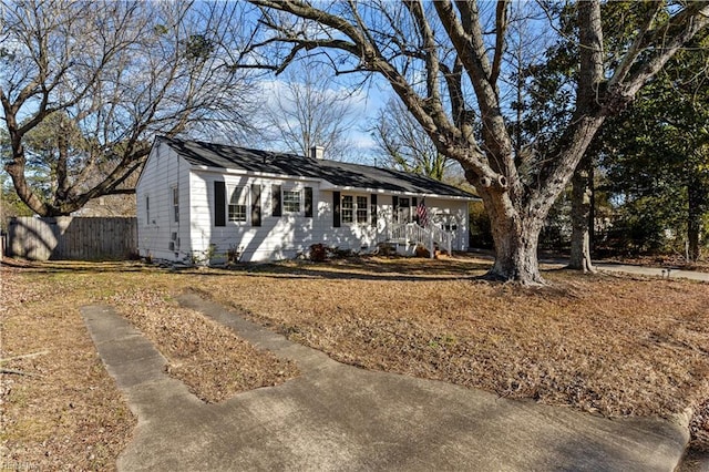 single story home with fence