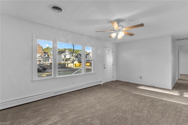 carpeted empty room with a baseboard radiator and ceiling fan