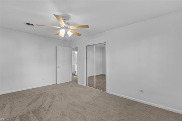 unfurnished bedroom with carpet flooring, a closet, and ceiling fan