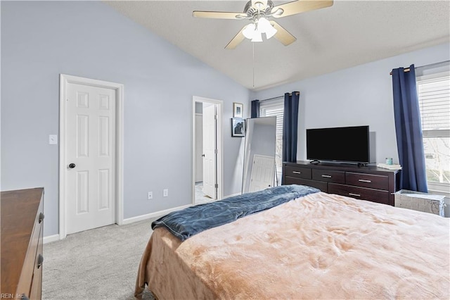 bedroom with ceiling fan, light carpet, and high vaulted ceiling