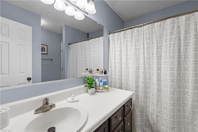 bathroom with vanity and a textured ceiling