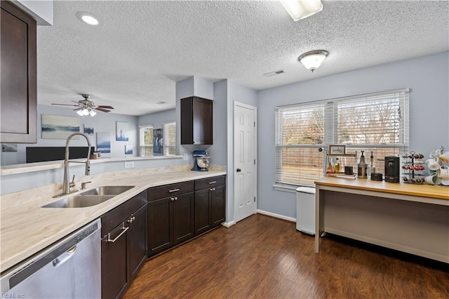 kitchen with stainless steel dishwasher, dark brown cabinets, ceiling fan, and sink