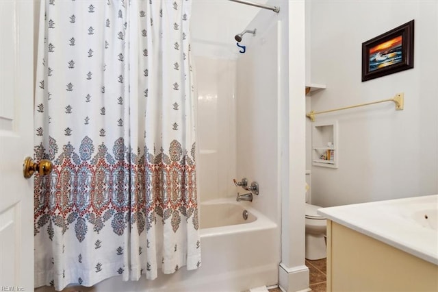 full bathroom featuring tile patterned floors, vanity, toilet, and shower / bath combo