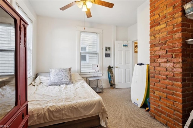 bedroom with light colored carpet and ceiling fan