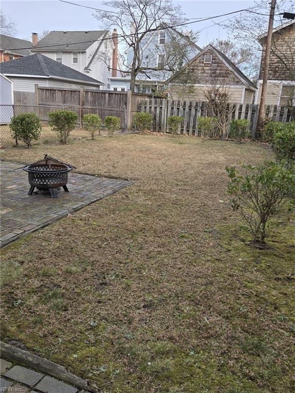 view of yard featuring a patio and a fire pit