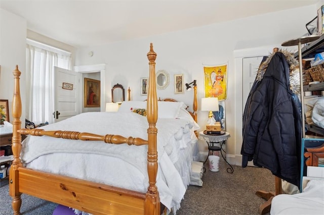 bedroom with carpet and a closet