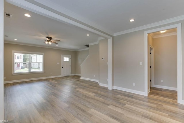 unfurnished living room with ceiling fan, light hardwood / wood-style flooring, and ornamental molding