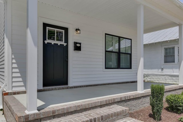 entrance to property with covered porch