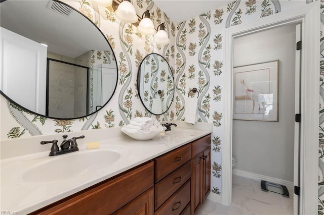 bathroom with vanity, toilet, and an enclosed shower