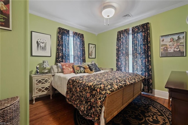 bedroom featuring dark wood-type flooring and ornamental molding