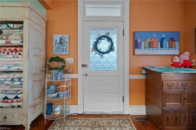 doorway to outside featuring wood-type flooring