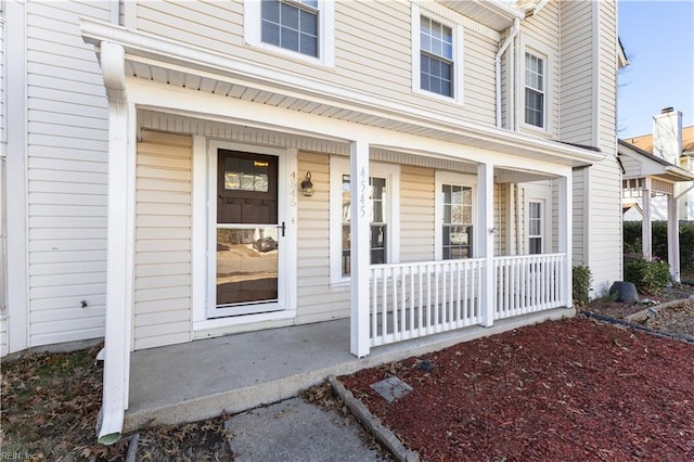 entrance to property featuring covered porch