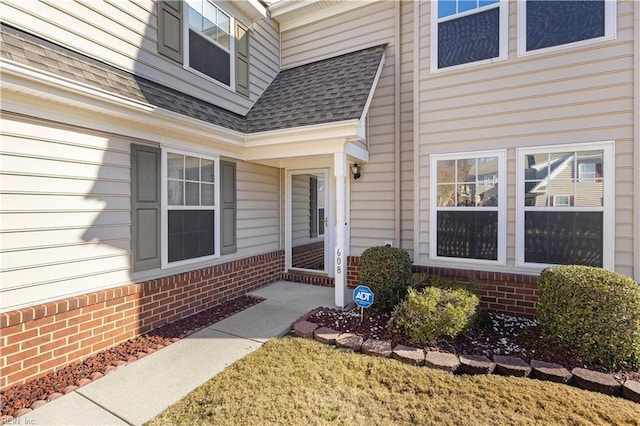 entrance to property with a yard