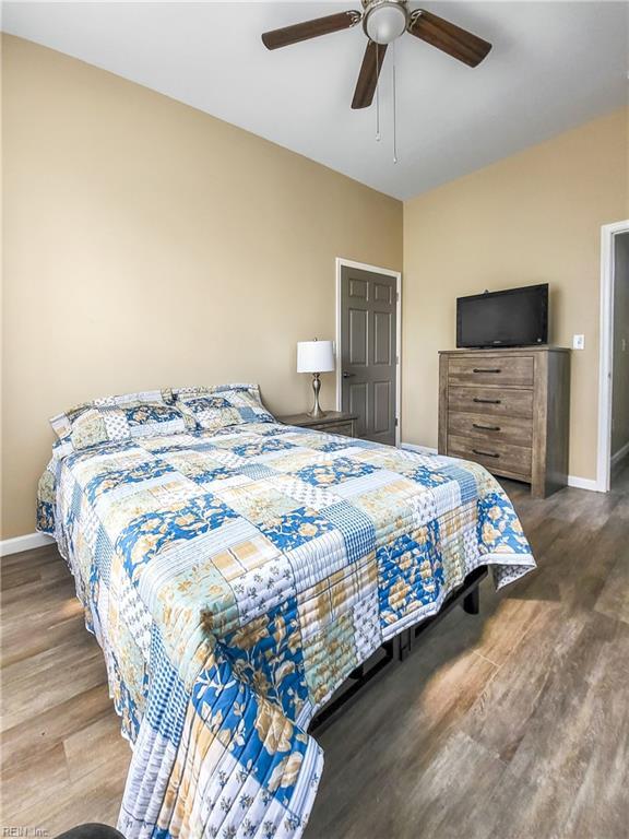 bedroom featuring ceiling fan and hardwood / wood-style flooring