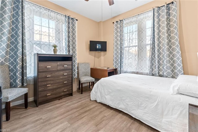 bedroom featuring ceiling fan and light wood-type flooring