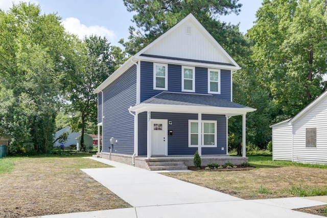 view of front facade featuring covered porch and a front lawn