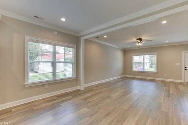 empty room with light hardwood / wood-style floors, ceiling fan, and ornamental molding