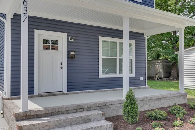 entrance to property featuring covered porch