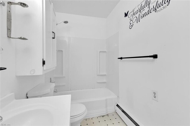 bathroom featuring  shower combination, toilet, and a baseboard heating unit