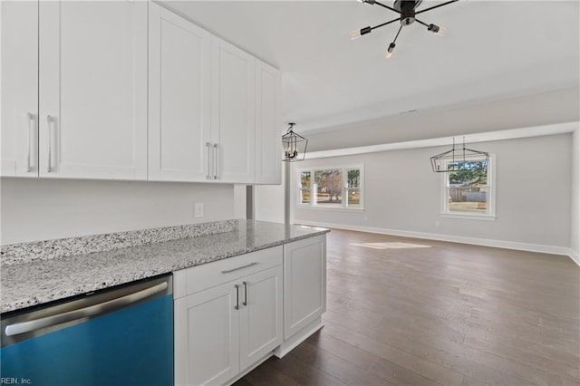 kitchen with dishwasher, light stone counters, white cabinetry, and decorative light fixtures