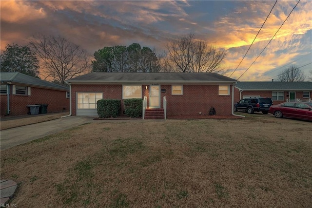 single story home featuring a yard