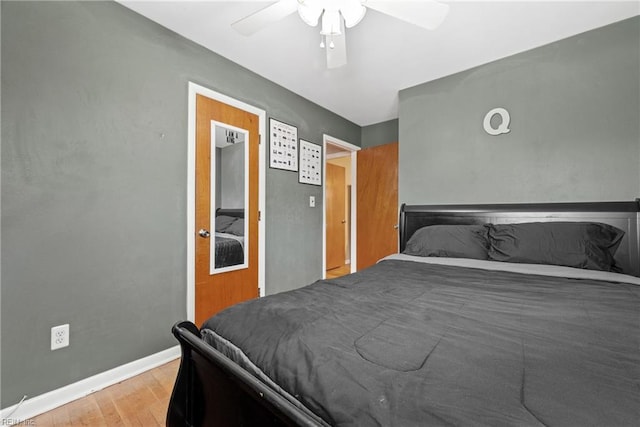 bedroom with ceiling fan and light wood-type flooring