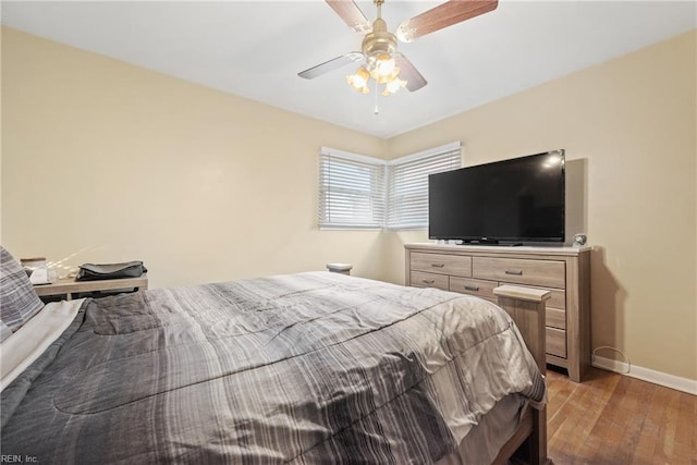 bedroom featuring light hardwood / wood-style floors and ceiling fan