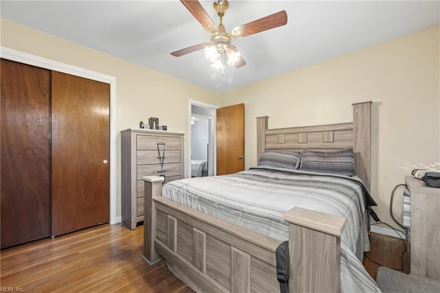 bedroom featuring a closet, ceiling fan, and hardwood / wood-style flooring