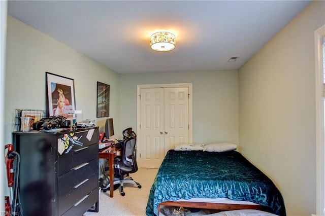 carpeted bedroom with a closet