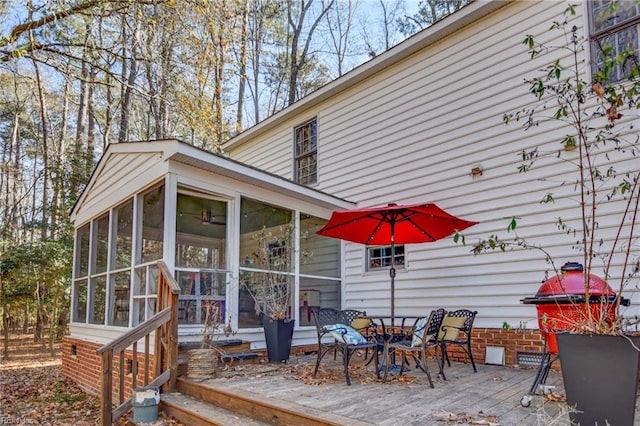 deck with a sunroom